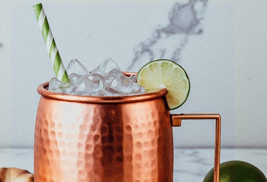 Picture of a moscow mule recipe with ice and a straw