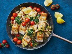 White fish fillets cooked with tomatoes and herbs in a single pan.