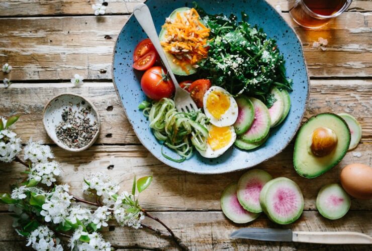 Roasted Broccoli and Cauliflower Pasta Bake: The Ultimate Comfort Food 27 overhead shot of golden bubbly roasted broccoli and cauliflower pasta bake in ceramic baking dish with melted cheese on top