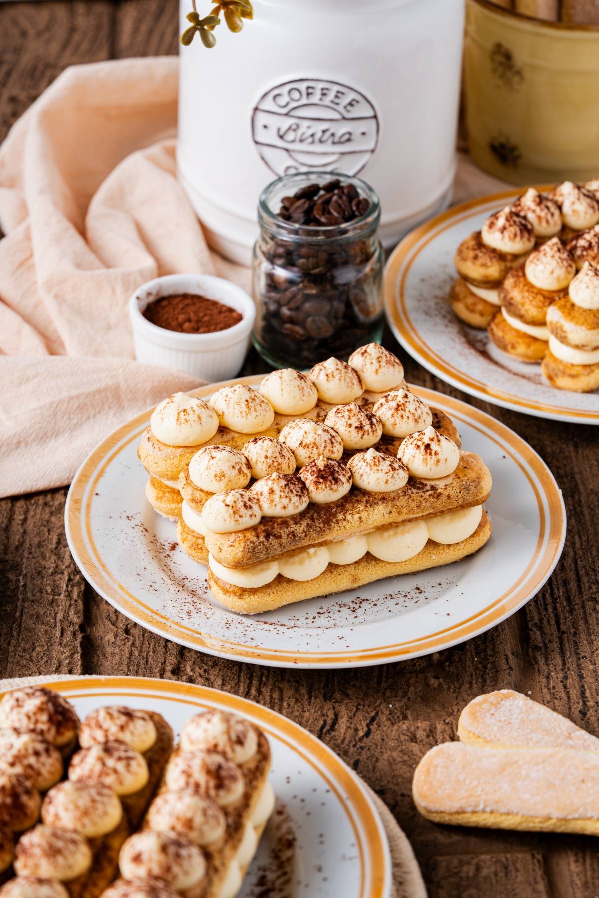 Classic Tiramisu Recipe - Authentic Italian Dessert for Special Occasions 26 Classic tiramisu in individual glass portions with perfectly dusted cocoa powder on top, garnished with coffee beans