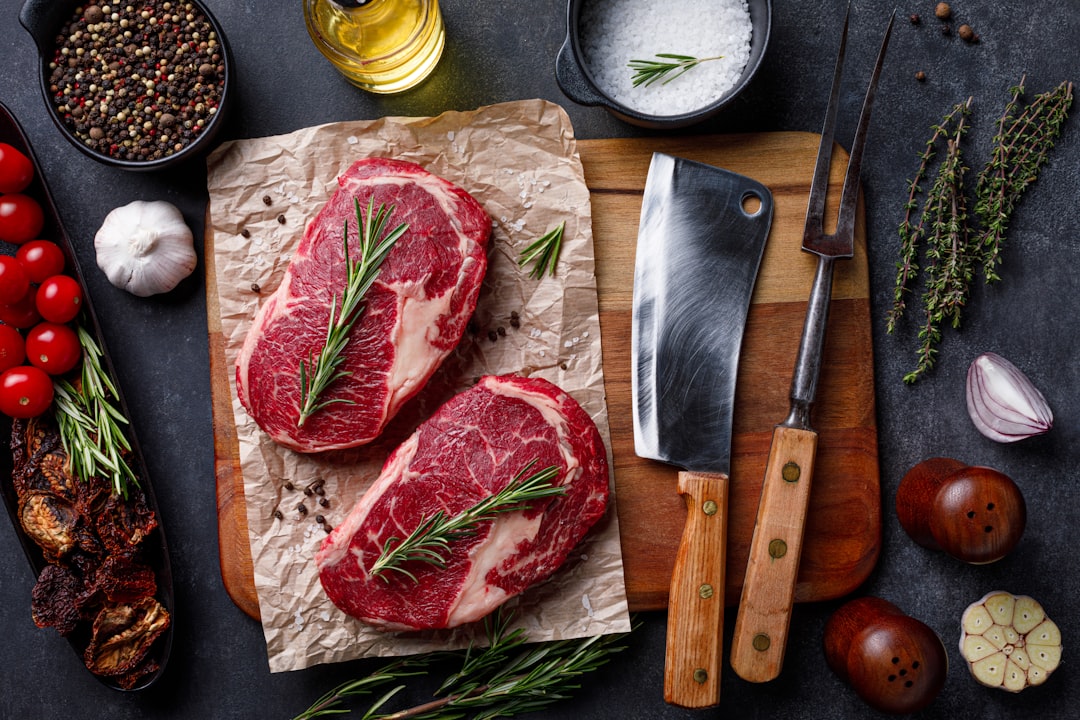 Instant Pot Beef Stew Recipe - Healthy Comfort Food in 45 Minutes 25 Chunks of beef being seared in the Instant Pot with golden-brown caramelization, alongside prepped vegetables on a cutting board