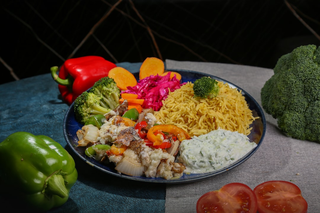 Mediterranean Chicken Bowl - Fresh, Healthy & Packed with Flavor 26 Mediterranean chicken bowl with golden herb-crusted chicken, colorful vegetables, quinoa and tzatziki beautifully arranged in a white ceramic bowl