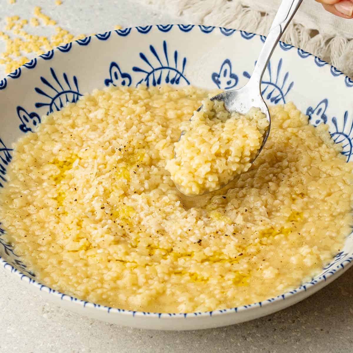 Buttered Pastina Recipe - Simple, Nourishing Italian Comfort Food 28 Close-up of creamy buttered pastina on a spoon showing the perfect texture and tiny star-shaped pasta