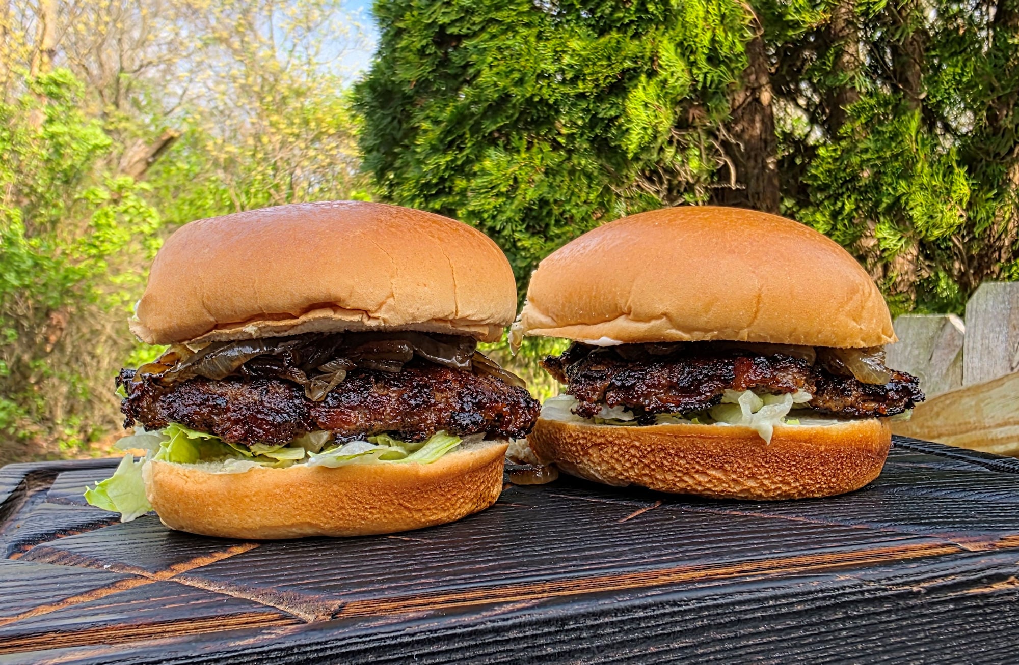 Bacon Ranch Burgers — Stuffed Cheddar Ranch Grilled Patty Recipe 27 Ground beef mixed with ranch seasoning in a bowl beside cubed cheddar cheese and raw thick-cut bacon on a marble surface
