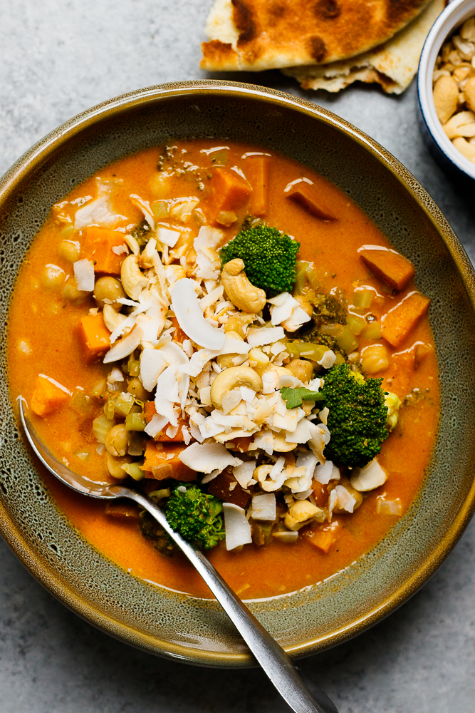 Faux-Massaman Vegetable Curry — Rich, Warming & Deeply Satisfying 28 Close-up of faux-massaman vegetable curry in a bowl showing sweet potato chunks, broccoli florets, and golden curry sauce, with a lime wedge and jasmine rice alongside