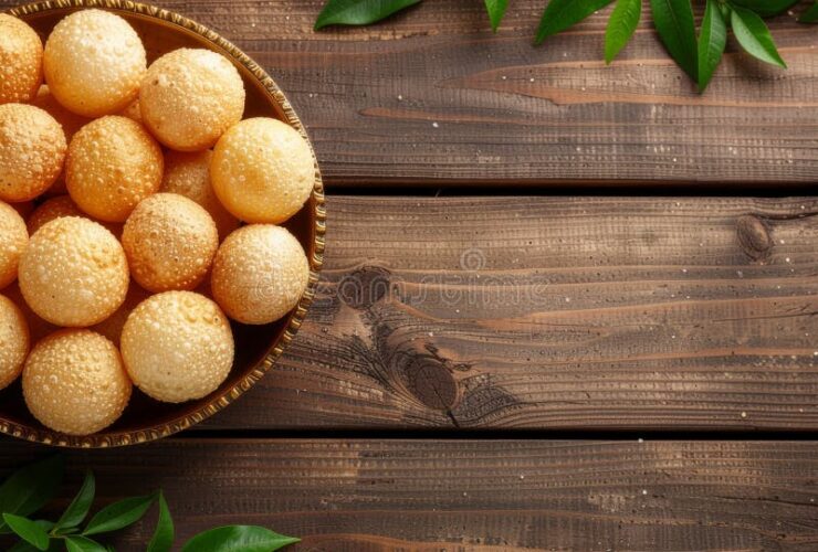 Golden Brazilian Pão de Queijo cheese puffs piled in a rustic linen-lined basket on a wooden board, beautifully lit with a warm overhead angle