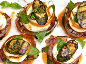 Grilled Zucchini Caprese Stacks Recipe — Elegant Summer Vegetarian Appetizer 36 Grilled zucchini caprese stacks arranged on a white marble serving board, drizzled with balsamic glaze and garnished with fresh basil leaves