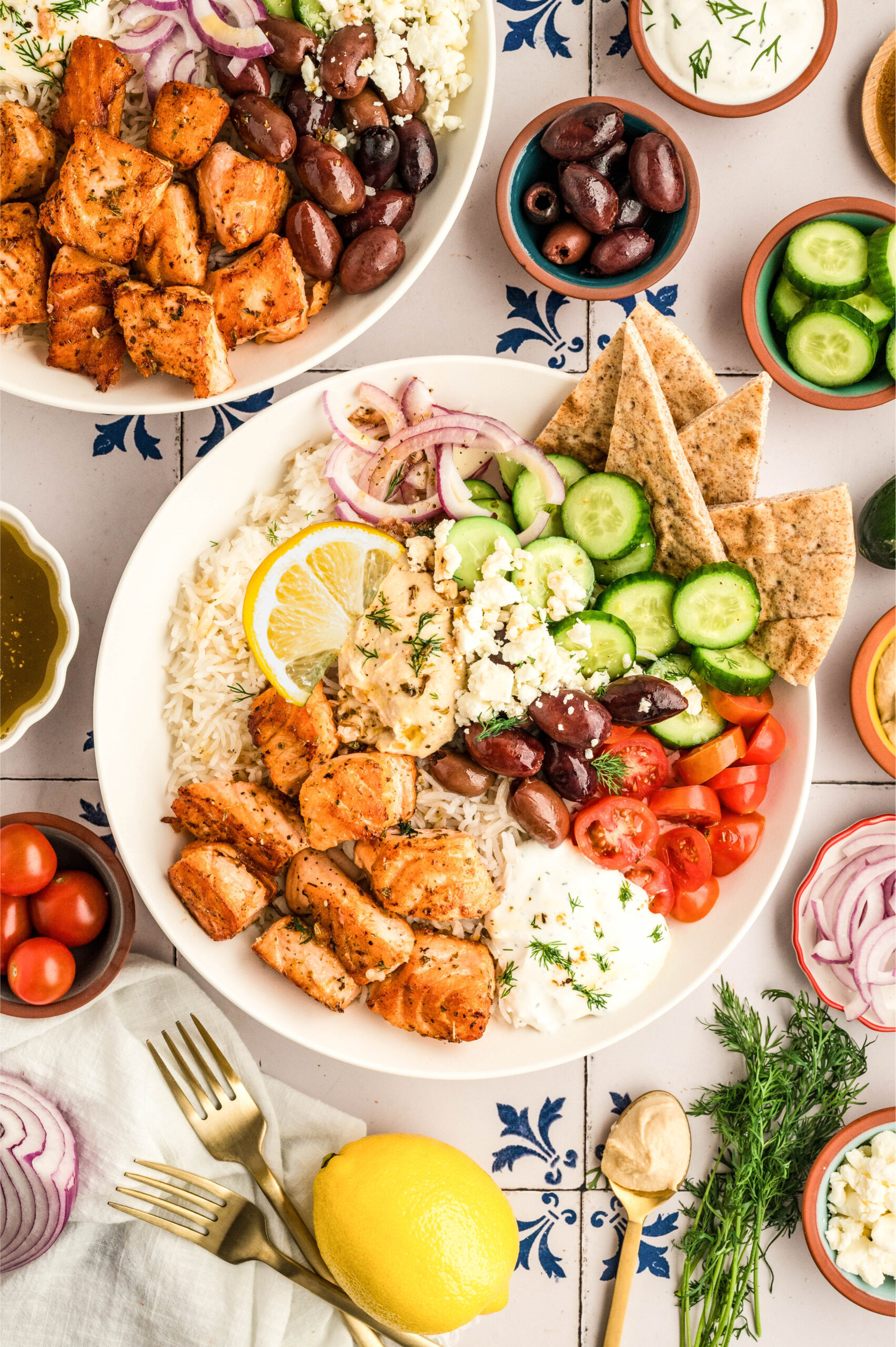 Overhead flat-lay of fresh herb crust ingredients including chopped parsley, dill, minced garlic, lemon zest, and olive oil in small prep bowls alongside raw salmon fillets and cut summer vegetables on a wooden cutting board