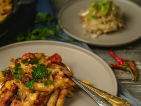 One Pot Creamy Cajun Chicken Pasta — Spicy, Smoky & Ready in 45 Minutes 16 One Pot Creamy Cajun Chicken Pasta served in a wide skillet with andouille sausage, colorful bell peppers, and a golden creamy sauce, garnished with fresh parsley
