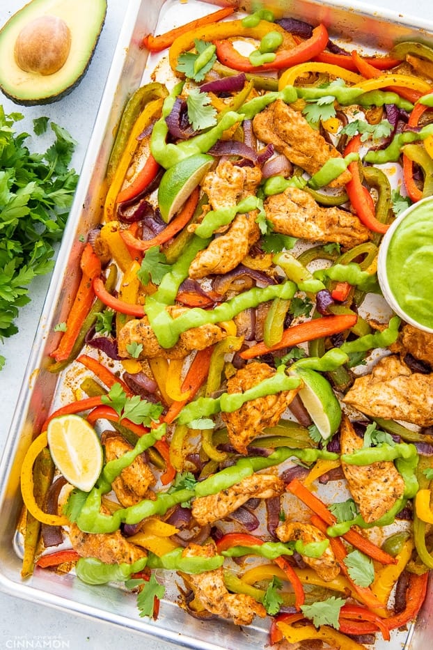 Sheet Pan Chicken Fajitas — The Easy, Healthy One-Pan Taco Night Winner 26 Sheet Pan Chicken Fajitas beautifully plated on a large wooden board with warm tortillas, sliced avocado, lime wedges, fresh cilantro, and colorful roasted peppers