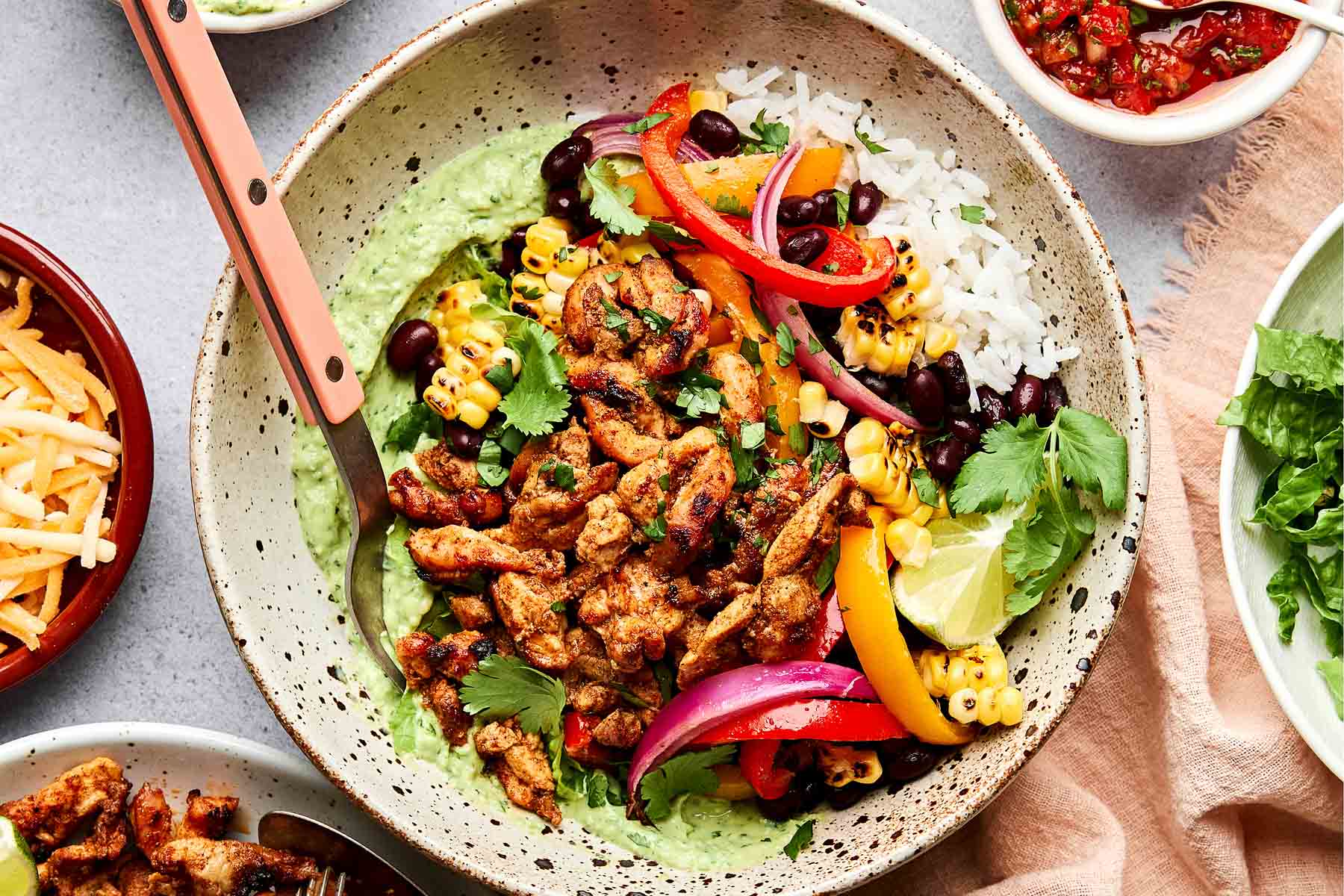 Sheet Pan Chicken Fajitas — The Easy, Healthy One-Pan Taco Night Winner 27 Overhead flat-lay of raw sliced chicken strips, colorful bell pepper strips, sliced onion, small bowls of fajita spices, olive oil, and fresh lime on a white marble surface