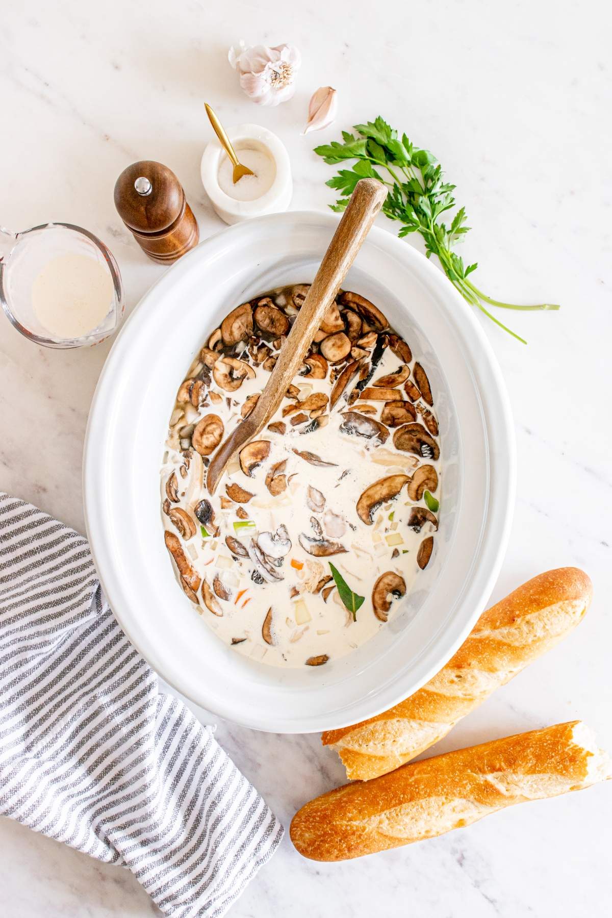 Slow Cooker Chicken Wild Rice Soup — Creamy, Hearty & Deeply Nourishing 26 Slow cooker chicken wild rice soup served in a rustic white bowl, garnished with fresh thyme, steam rising, on a wooden table with a cozy linen napkin