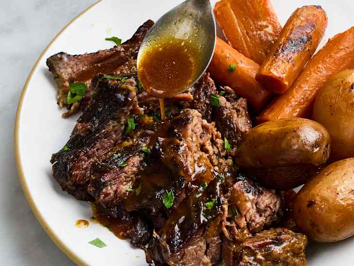 Slow Cooker Pot Roast — Classic Chuck Roast with Root Vegetables and Savory Gravy 26 Slow cooker pot roast with tender chuck roast, carrots, potatoes, and rich savory gravy served in a rustic bowl, beautifully plated