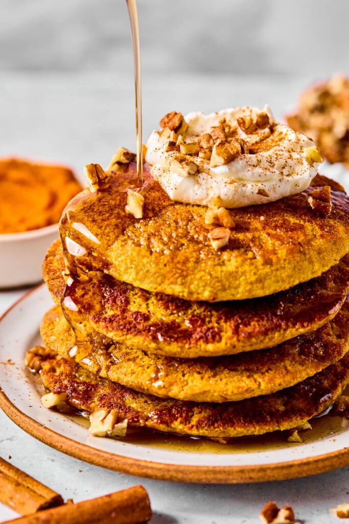 High Protein Pumpkin Pancakes — Fluffy, Nourishing & 25g+ Protein Per Stack 11 Overhead flat lay of high protein pumpkin pancake ingredients — oat flour, pumpkin puree, Greek yogurt, whey protein, eggs, spices arranged on a marble surface