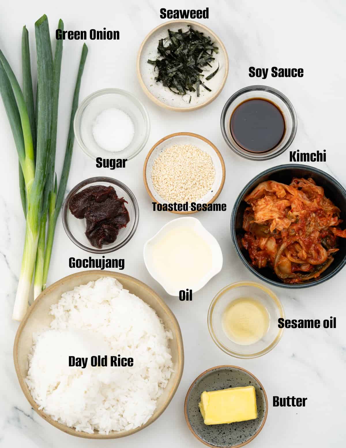 Kimchi Fried Rice — Fermented Cabbage Fried Rice Topped with a Jammy Egg 11 Overhead flat lay of kimchi fried rice ingredients — chopped kimchi on a cutting board, a bowl of day-old rice, eggs, gochujang paste in a small bowl, soy sauce, sesame oil, and scallions on a light linen background