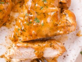 Lighter Apple Cider Chicken Skillet — A Wholesome Fall Dinner Ready in 35 Minutes 17 Close-up of lighter apple cider chicken sliced and plated over farro with apple slices and a drizzle of cider pan sauce