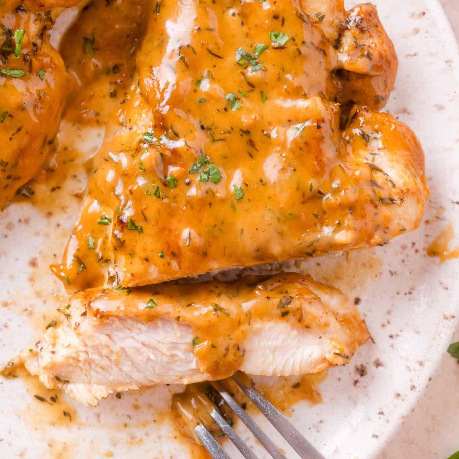 Lighter Apple Cider Chicken Skillet — A Wholesome Fall Dinner Ready in 35 Minutes 12 Close-up of lighter apple cider chicken sliced and plated over farro with apple slices and a drizzle of cider pan sauce