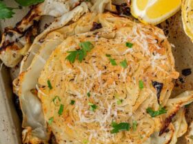 Roasted Cabbage Steaks — Crispy-Edged, Caramelized & Surprisingly Addictive 34 Roasted cabbage steaks on a sheet pan with crispy golden edges, drizzled with olive oil and garnished with fresh parsley