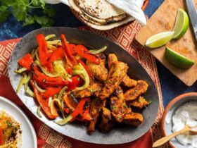 Sheet Pan Chicken Fajitas — The Easy, Healthy One-Pan Taco Night Winner 19 Overhead flat-lay of raw sliced chicken strips, colorful bell pepper strips, sliced onion, small bowls of fajita spices, olive oil, and fresh lime on a white marble surface