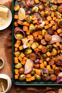 Sheet Pan Turkey Sausage and Fall Vegetables — Easy, Nourishing One-Pan Dinner 13 Sheet pan turkey sausage and fall vegetables beautifully roasted on a parchment-lined pan with caramelized Brussels sprouts, golden delicata squash, and sweet potato